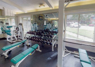 Fitness Center With Workout Equipments & Large Windows