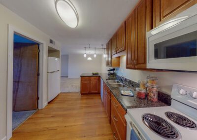 Modern Kitchen Featuring Hardwood Floors And Cabinetry